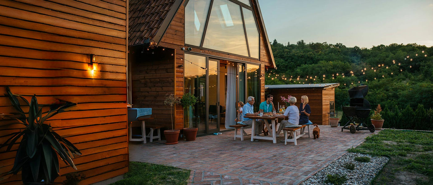 Friends gather to chat and enjoy a meal in the off-grid home.